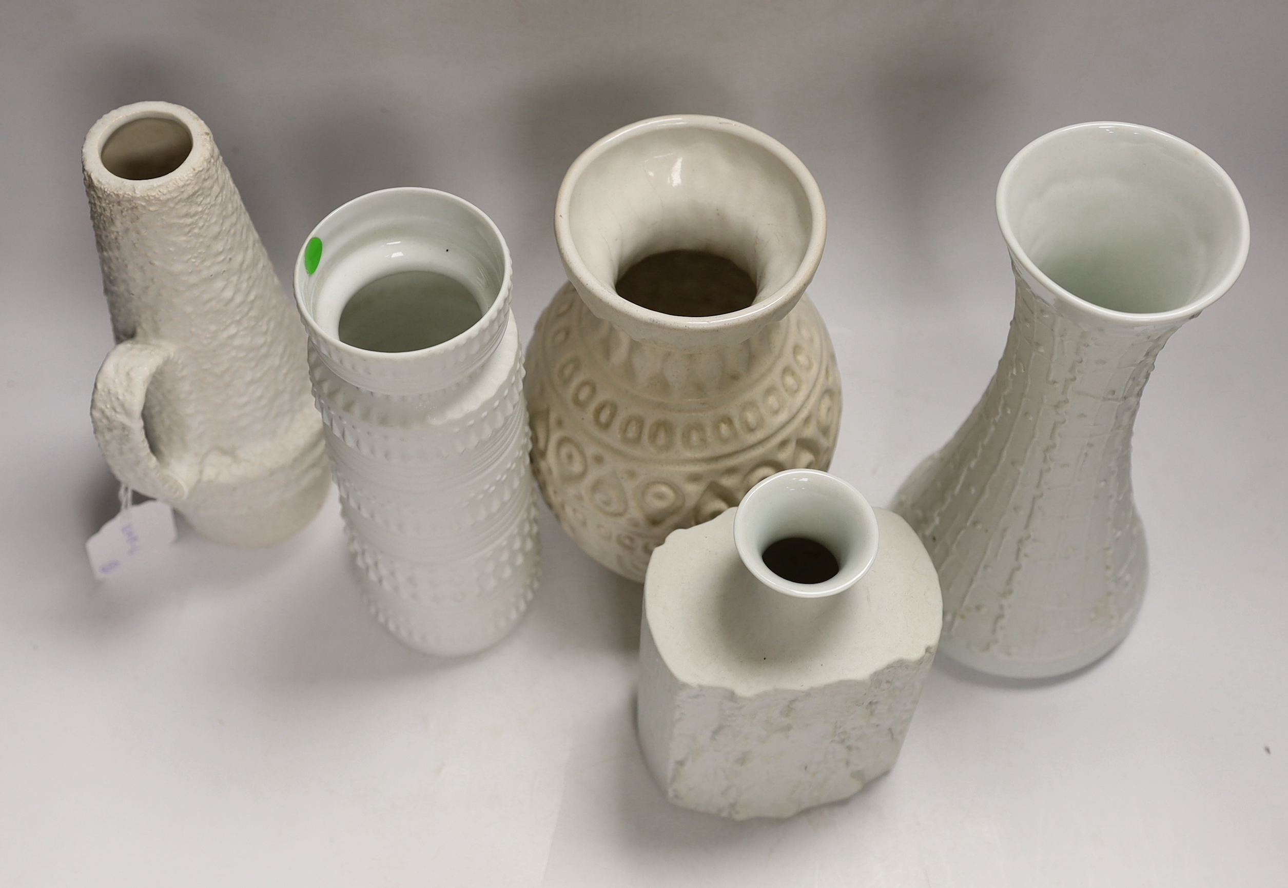 Five West German pottery and biscuit porcelain vases, tallest 24cm